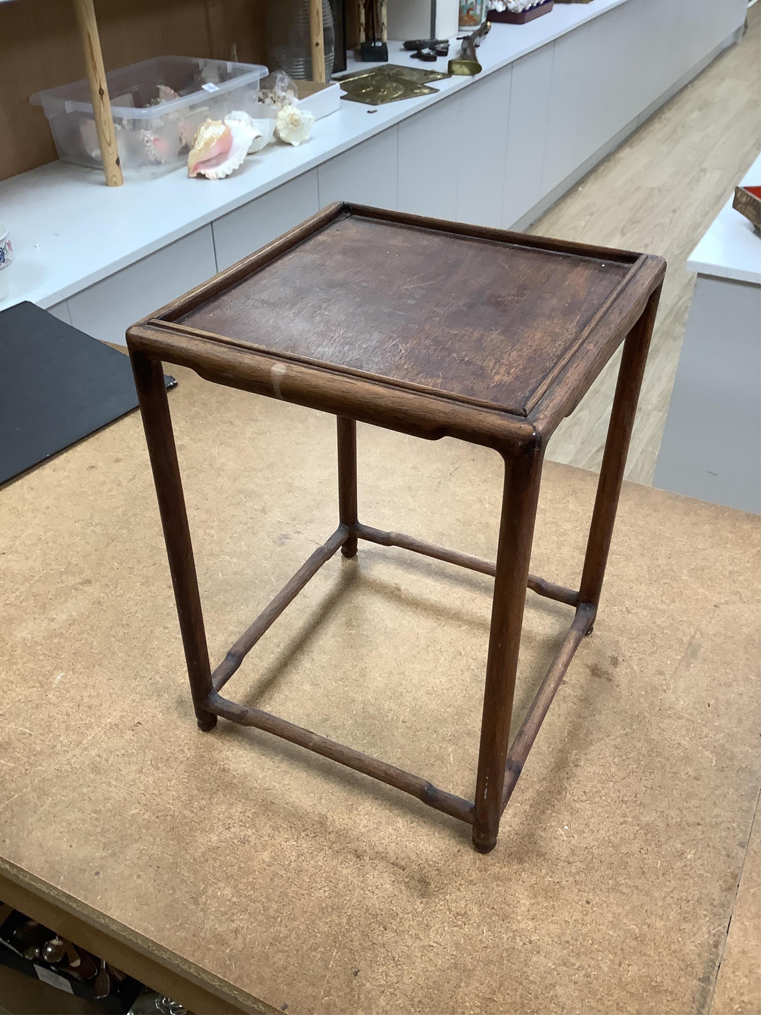 A nest of five Chinese hardwood stands, tallest (largest) 32cm high